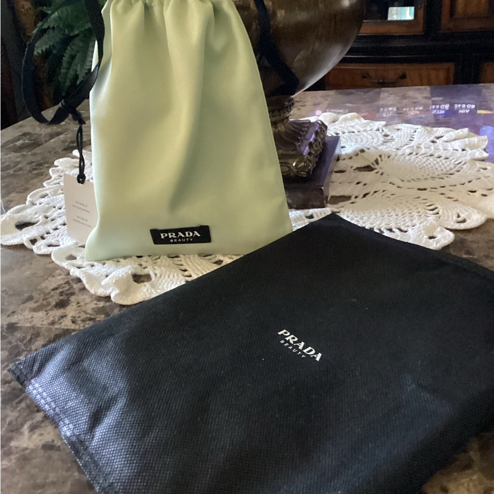 Prada make up drawstring bag and dust bag.